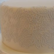 Ivory fondant with white lace cake