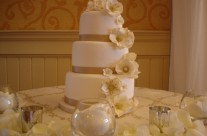 Gold ribbon wedding cake